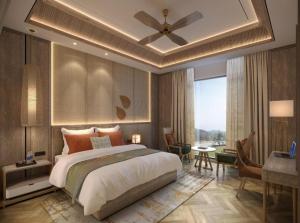 Postel nebo postele na pokoji v ubytování Hotel Grand Havenwood suites Near Delhi Airport