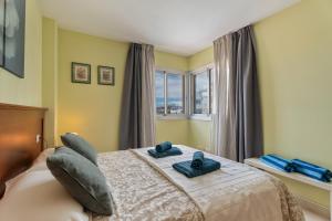 Ένα ή περισσότερα κρεβάτια σε δωμάτιο στο Apartamento Sol Paraiso +24 φωτογραφίες