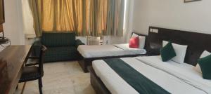 Postel nebo postele na pokoji v ubytování Hotel Fringo