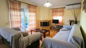 TV a/nebo společenská místnost v ubytování Paradise Beach Villa