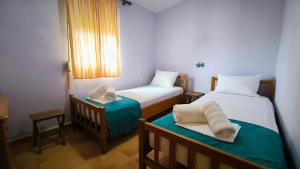 Postel nebo postele na pokoji v ubytování Paradise Beach Villa