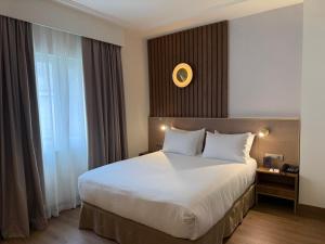 Postel nebo postele na pokoji v ubytování Hotel Olid