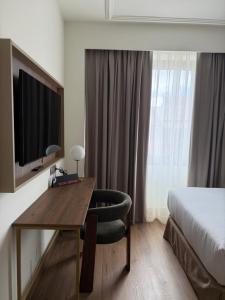 TV a/nebo společenská místnost v ubytování Hotel Olid