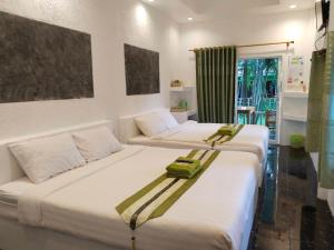 Postel nebo postele na pokoji v ubytování Green Resort Koh Chang