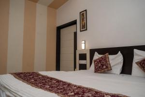 Voodi või voodid majutusasutuse Hotel Ruby toas