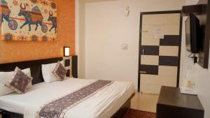 Voodi või voodid majutusasutuse Hotel Ruby toas