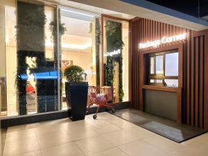 a store front with a shopping cart in a mall at Cozy Tanglin Studio at SuperMall Mansion, Pakuwon Mall West Surabaya - by Le Ciel Hospitality in Surabaya +42 photos