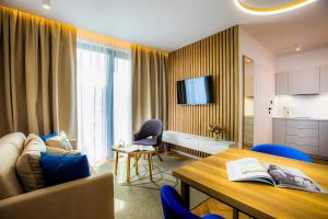 TV a/nebo společenská místnost v ubytování TILIA Resort