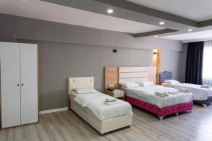 a hotel room with two beds at RİO's HOTEL KURTKÖY in Istanbul +23 photos
