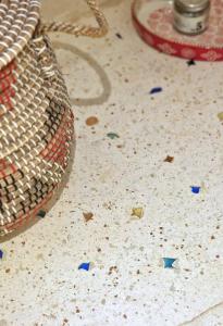 a counter with a basket and debris on the floor at MandorleOlio in Polignano a Mare