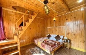 Postel nebo postele na pokoji v ubytování Hamlet Homestay