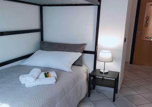 Postel nebo postele na pokoji v ubytování Albergo Diffuso Volterra