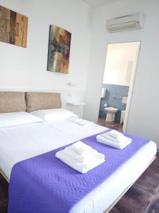 Postel nebo postele na pokoji v ubytování B&B Torrefano