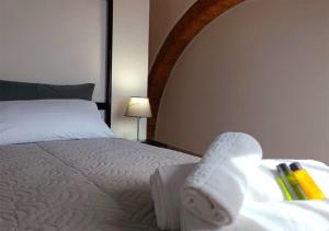 Postel nebo postele na pokoji v ubytování Albergo Diffuso Volterra