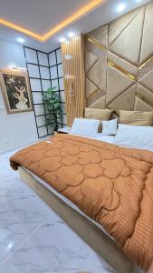 a bedroom with a large bed in a room at ParkView City Lake Facing in Malot