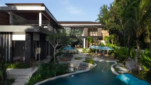 a hotel with a swimming pool and a resort at Villa Baliga Ubud by BaliSuperHost in Ubud