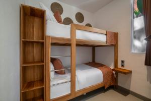 a bedroom with two bunk beds in a room at Villa Baliga Ubud by BaliSuperHost in Ubud