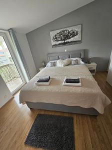 Postel nebo postele na pokoji v ubytování Apartmani Tereza