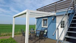 Balkón nebo terasa v ubytování Prima Resort Boddenblick - Camping-Stellplätze - Tiny Houses & Ferienwohnungen in Ostsee Nähe
