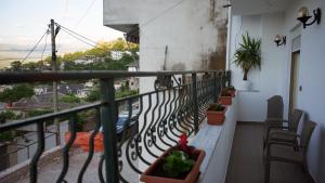 a balcony with a view of a street at Paris's Apartment in Gjirokastër