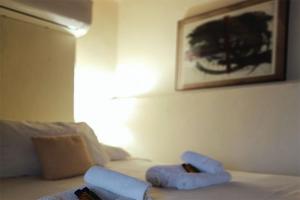Postel nebo postele na pokoji v ubytování Albergo Diffuso Volterra