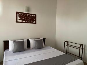 Postel nebo postele na pokoji v ubytování BlissFam Villa & Hostel
