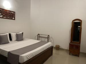 Postel nebo postele na pokoji v ubytování BlissFam Villa & Hostel