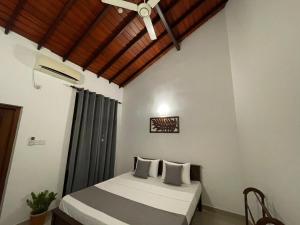 Postel nebo postele na pokoji v ubytování BlissFam Villa & Hostel