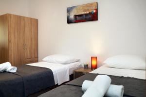 Posteľ alebo postele v izbe v ubytovaní Apartments Lada