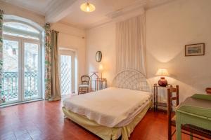 a bedroom with a bed and a large window at Massenet in Lapalme