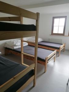 Postel nebo postele na pokoji v ubytování Schronisko PTTK Pod Muflonem