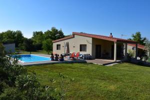 a house with a swimming pool in the yard at Villa Asteria in Samothraki