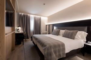 Uma cama ou camas num quarto em Hotel Màgic Pas