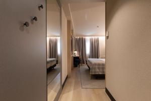Uma cama ou camas num quarto em Hotel Màgic Pas