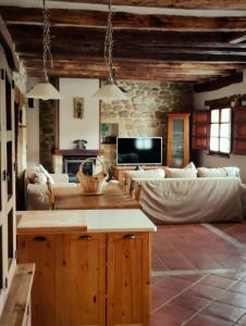 a living room with a couch and a table at El Limonero in Arenas de Iguña