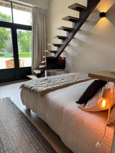 Postel nebo postele na pokoji v ubytování Au Détour des Châteaux