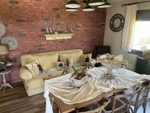a living room with a couch and a table at VILLA PETER in Alexandroupoli