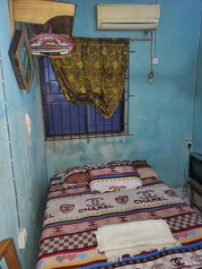Katil atau katil-katil dalam bilik di Top Guest Room