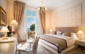 Rúm í herbergi á Hotel Kvarner - Liburnia