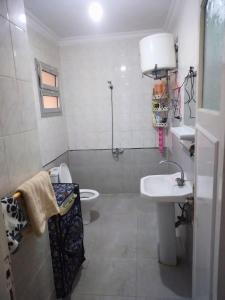 a bathroom with a sink and a toilet at Gadou Rooms -Private & Shared Stays in Port Said Best Location in Port Said +37 photos