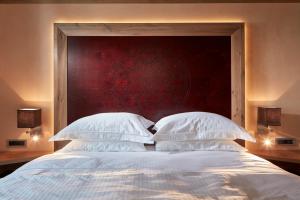 Postel nebo postele na pokoji v ubytování Domus Renier Boutique Hotel