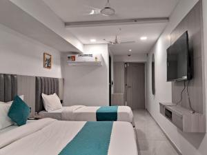 TV a/nebo společenská místnost v ubytování Hotel Metro Inn + 22 fotografií