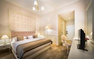Rúm í herbergi á Hotel Kvarner - Liburnia