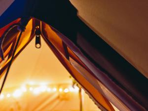 a close up of a tent with a droplet of water at The Paddock Wildcamp in Perranporth +59 photos