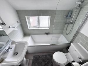 Koupelna v ubytování Cozy Place + 10 fotografií