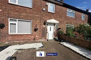 a brick house with a white door and a driveway at Modern 3-Bed By Avalora Short Lets & Serviced Accommodation Near Manchester Airport With Parking, Ideal for Long Stays in Wythenshawe
