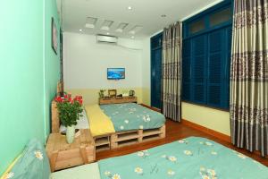 Postel nebo postele na pokoji v ubytování Sunny Hanoi Homestay