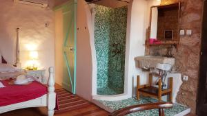 a bedroom with a shower and a sink in it at Charming stone villa in a peaceful setting near Crikvenica in Barci +38 photos