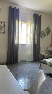 Posteľ alebo postele v izbe v ubytovaní A Casa di Giù B&B