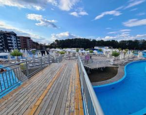 a view from the deck of a pool at a resort at Apartman Vuk in Vrnjačka Banja